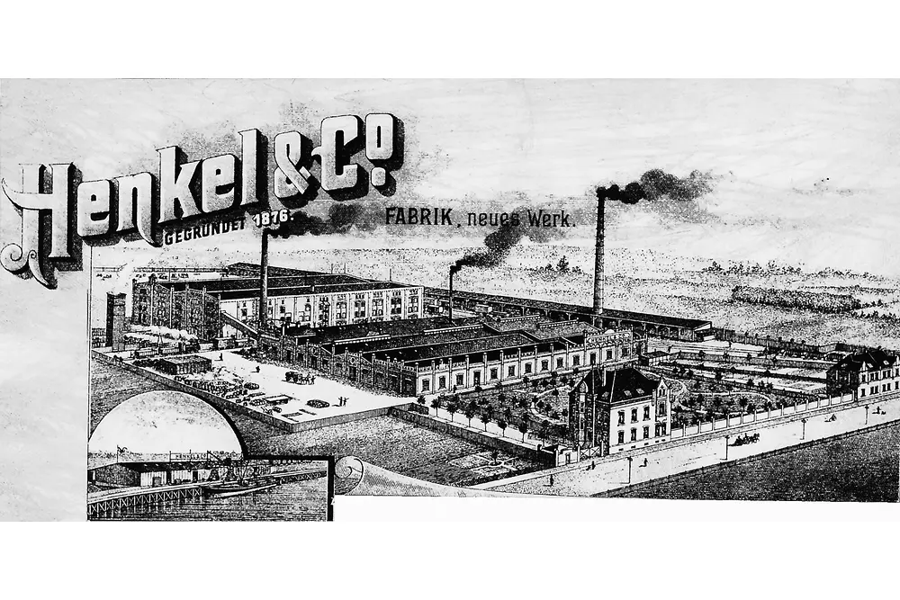 Darstellung von Henkel aus dem Jahr 1902 mit Abbildung des Werkstandorts in Düsseldorf-Holthausen und dekorativen grafischen Elementen.
